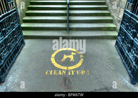 Clean it up! Sign stenciled on pavement Stock Photo