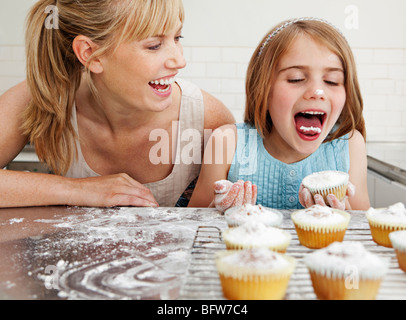 Mum and daughter with cakes Stock Photo