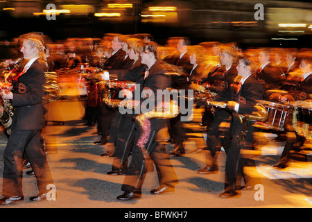 High school marching band in 2009 Victoria Santa Claus parade through downtown-Victoria, British Columbia, Canada. Stock Photo