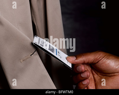 Business man looking at price tag Stock Photo