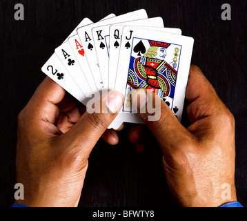 Business man with winning cards Stock Photo