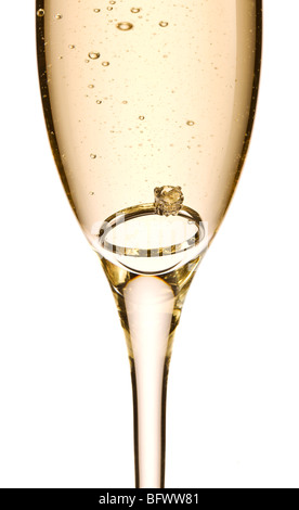 Engagement ring in glass of champagne Stock Photo