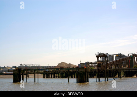 A pier, and conveyor belt for sand on the Thames estuary, near London Stock Photo