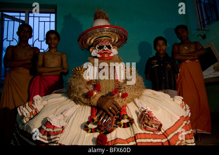 Hanuman a character in Kathakali play, waits backstage for his performance at a theatre in Trivandrum, Kerala Stock Photo