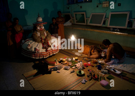 Hanuman a character in Kathakali play, waits backstage for his performance at a theatre in Trivandrum, Kerala Stock Photo