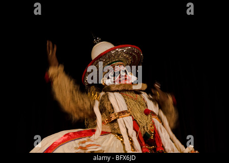 Hanuman, king of  the monkeys, a character in a Kathakali play, performing in a theatre in Trivandrum, Kerala, India Stock Photo