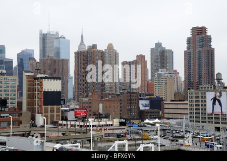 The west side of midtown Manhattan has old commercial buildings, a highway, and new apartment buildings. Stock Photo