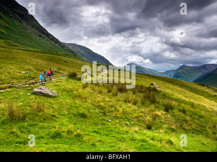 A family group making its way along the tourist path up Ben Nevis in the Scottish Highlands Stock Photo