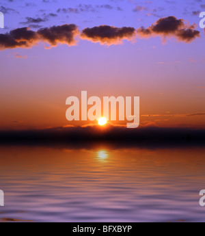 beautiful sunrise with few clouds over sea Stock Photo