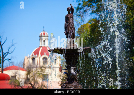 Fountain and Church of San Juan de Dios in Alameda Central in Mexico CIty Stock Photo