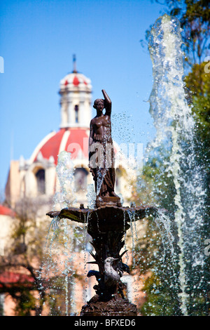 Fountain and Church of San Juan de Dios in Alameda Central Park in Mexico CIty Stock Photo