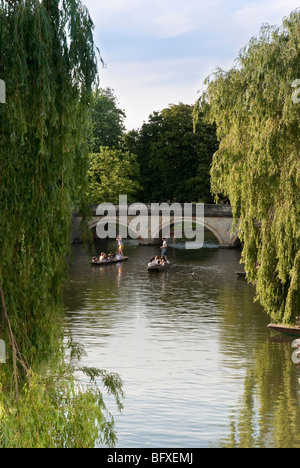 Punting on the River Cam in Cambridge on a warm summer's evening with Clare bridge in the background Stock Photo