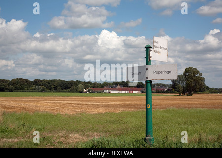 Road signs and the world famous Westvleteren abbey in the background Stock Photo