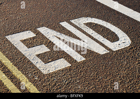 'End' road marking Stock Photo