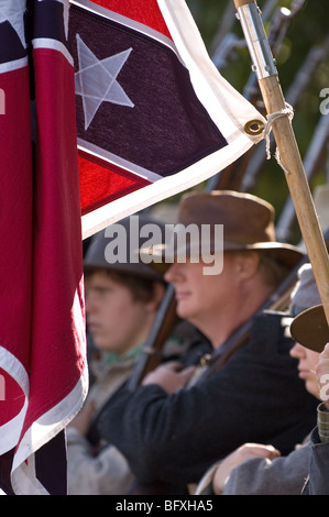 Scenes from a Civil War re-enactment of the Battle of Gettysburg; back lit Confederate flag Stock Photo