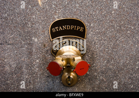 Standpipe on the outside of a office building in Rockefeller Center in New York Stock Photo