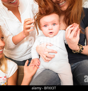 young women playing with baby Stock Photo