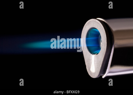 Close up of a burning blue flame from a cooking torch - on a black background. Stock Photo