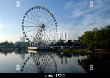 City Skyline with Petronas Towers & Eye on Malaysia Ferris Wheel, Titiwangsa Lake Gardens, Kuala Lumpur, Malaysia Stock Photo