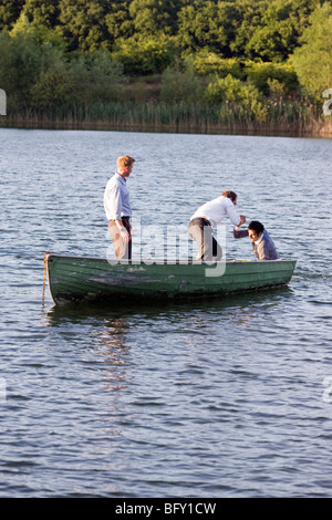 businessman helping man overboard Stock Photo