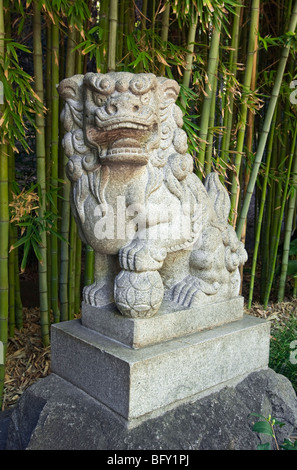 Chinese Guardian Lions with a bamboo backdrop. Stock Photo