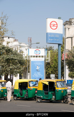 Compressed Natural gas powered auto-rickshaws wait outside Rajiv Chowk station in Connaught Place, New Delhi, India Stock Photo