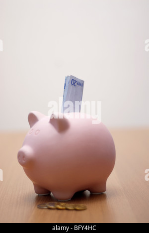 piggy bank with money in it Stock Photo