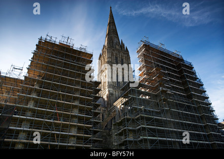 Salisbury Cathedral, Wiltshire, UK under repair and restoration with scaffolding dominating the image Stock Photo