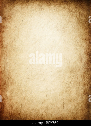 Antique yellowish parchment paper grungy background texture Stock Photo