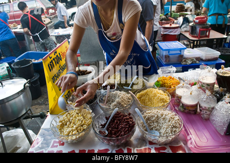 Thai snacks for sale in a local market in Chiang Rai, Thailand.