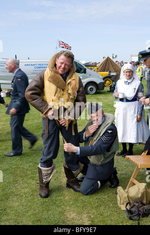Battle of Britain pilot being dressed by his batman. Re-enactment in Sussex, England. Stock Photo