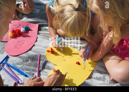 Teacher teaching students arts & crafts Stock Photo