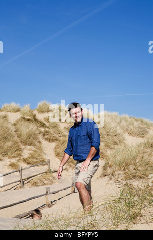 Mid adult man on the beach Stock Photo