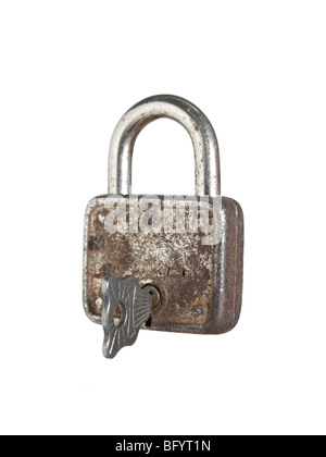A closed lock with a key isolated on white background Stock Photo - Alamy