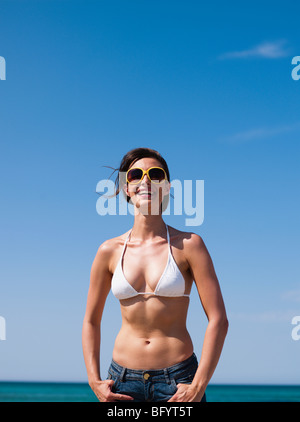 woman with sunglasses looking at viewer Stock Photo
