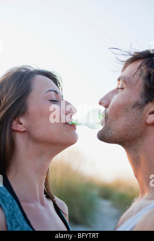 couple playing with bubble gum Stock Photo