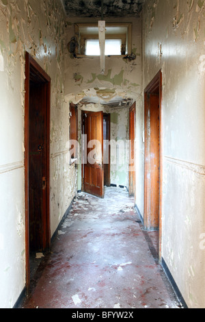 Corridor in an abandoned mental asylum psychiatric hospital in Mid Wales Stock Photo