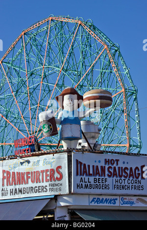 Mascot on top of concession stand / snack bar, with famous Wonder Wheel in background, Coney Island, Brooklyn, NY Stock Photo