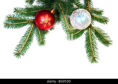 Christmas balls on fir tree branch on white background Stock Photo