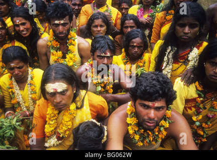 A group of South India Hindu devotees rest before they participate in a fire walking festival in Manjacombi in the Nilgiris Hills in the state of Tamil Nadu, India Fire walking is an important ritual practiced by certain sections of Hindu society. The ritual is practiced by many Hindus in South India. The ritual is primarily dedicated to Amman an important female deity associated with Shakti cult in South Indian and Tamil culture. The fire walking ritual is an act of self-purification. Stock Photo