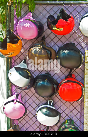 'Designer' crash helmets on stall at 'Hippie Market' Sant Carles , Ibiza. Stock Photo