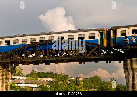 A train crosses the famous bridge over river Kwai. Stock Photo