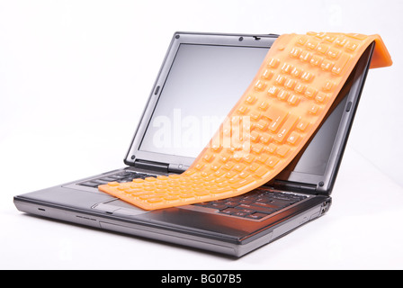 laptop and flexible orange keyboard isolated Stock Photo