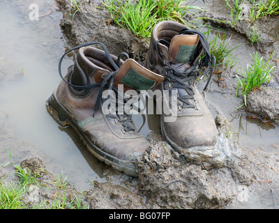 Boots being stuck in the mud. Stock Photo