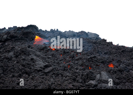 Flowing Lava and Tourists towards the Pacaya Volcano Peak. Volcan Pacaya National Park. Stock Photo