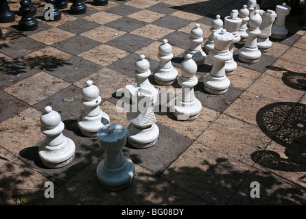 Outdoor chess game pieces awaiting players Stock Photo