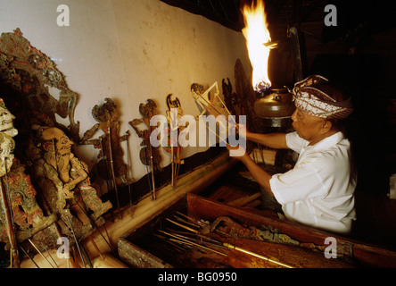 Dalang or puppeteer at Wayang Kulit (Shadow Puppet Play) in Bali, Indonesia, Southeast Asia Stock Photo