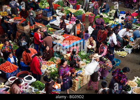 Shoppers and vendors at busy outdoor market, elevated view in Chichicastenango Guatemala. Stock Photo