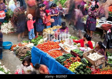 Shoppers and vendors at busy outdoor market, elevated view in Chichicastenango Guatemala. Stock Photo