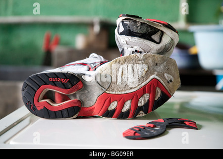 Destroyed Sport Shoes after the visit of Pacaya Volcano Guatemala Stock Photo
